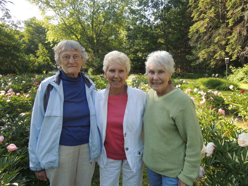 Edith McCormick, Elizabeth Johnson and Joan Roux, all of Portland, enjoy the formal peony garden at Gilsland Farm.