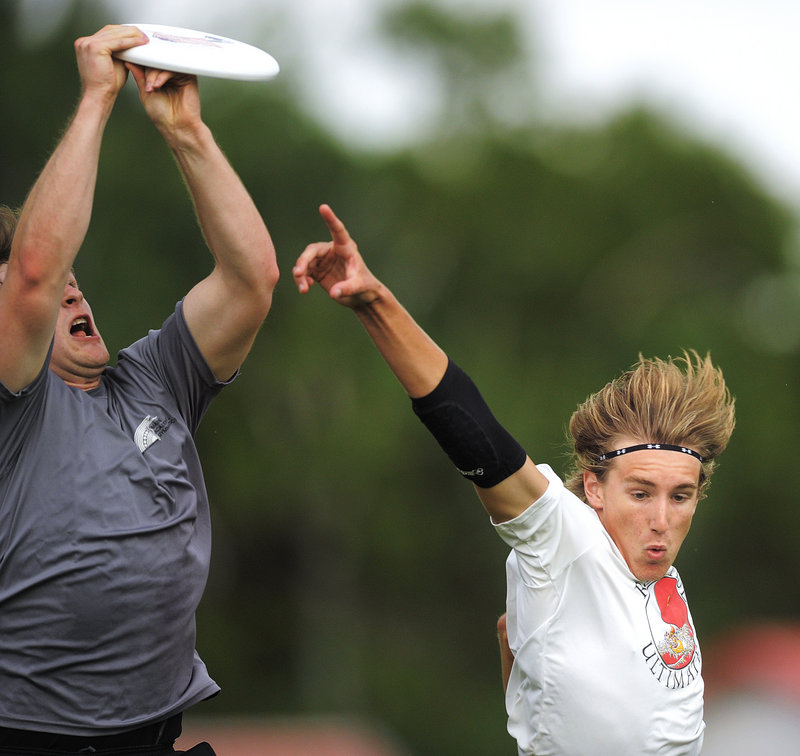 Jacob Brady of Cape Elizabeth, right, has the disc sail over his head. USA Ultimate, the national governing body, may select Portland as the site of the Northeast Regional next May.