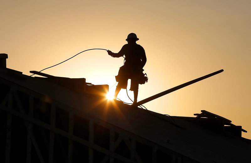A construction worker in Queen Creek, Ariz., tries to beat a western U.S. heat wave by starting at sunrise. Temperatures in Arizona have hit 118 degrees and even northern Utah is expected to break the triple-digit mark.