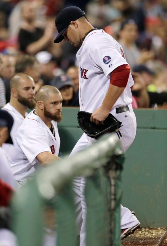John Lester heads to the dugout after hip pain forced him off the mound during Thursday’s victory over Toronto at Fenway Park.