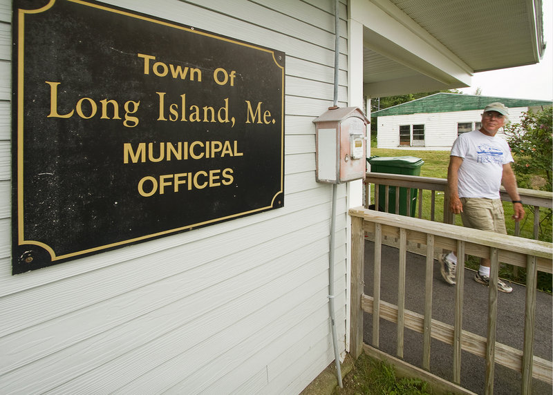 Long Island resident Mark Greene leaves the Municipal Offices building, which the town acquired after it seceded from Portland.