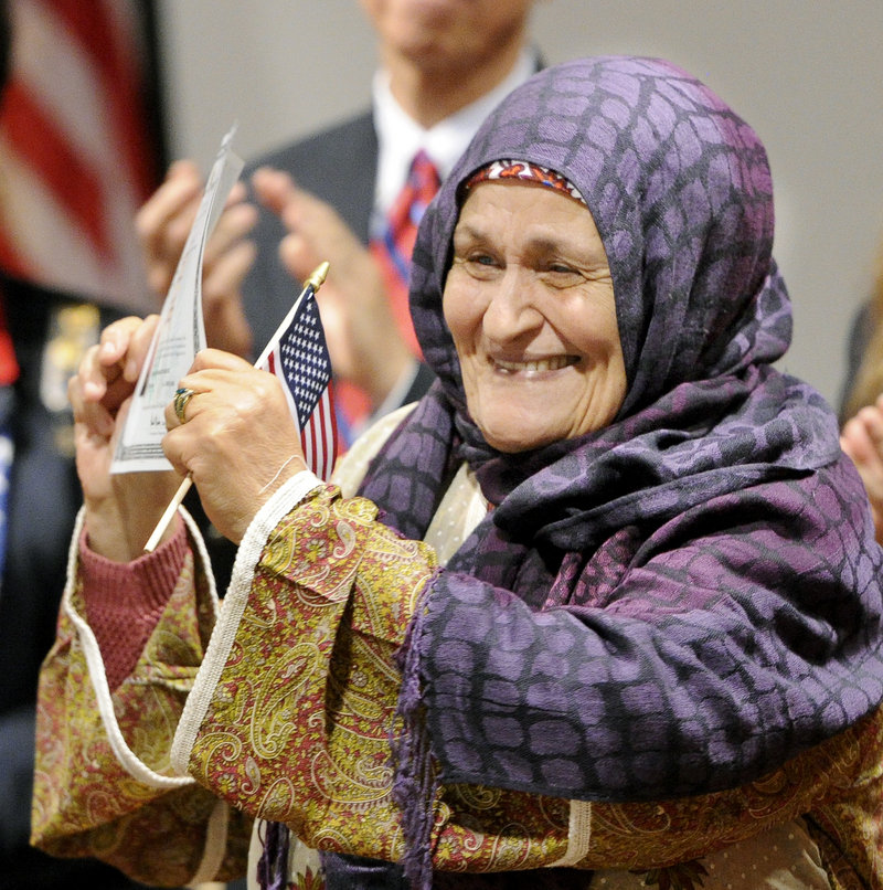 Fatima Mouifadan, from Morocco and now of Lewiston, proudly celebrates.