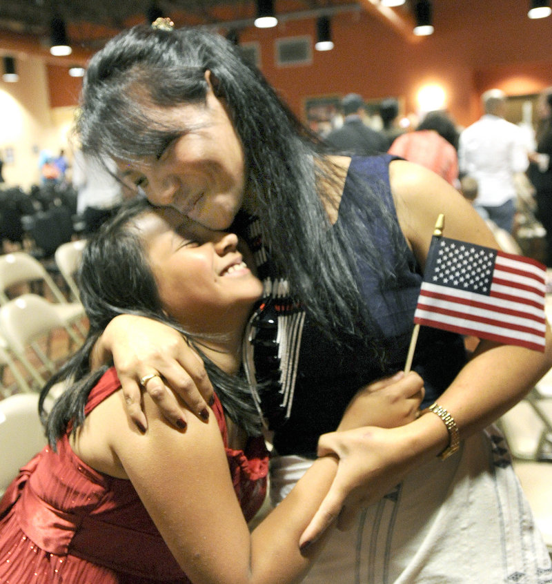 Kumari Lucas, from India and now of Topsham, is hugged by daughter Anna.