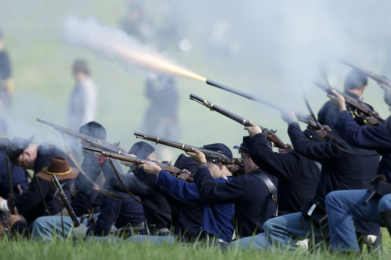 Union re-enactors participate in a battle during ongoing activities commemorating the 150th anniversary of the Battle of Gettysburg, the pivotal battle of the Civil War, on Friday at Bushey Farm in Gettysburg, Pa.