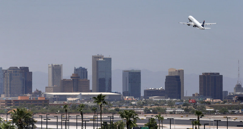 A jet takes off from Sky Harbor International Airport in Phoenix on Friday. Airlines are monitoring temperatures to make sure it’s safe to fly as heat engulfs much of the Southwest. Extreme temperatures make it difficult for smaller planes to lift off.