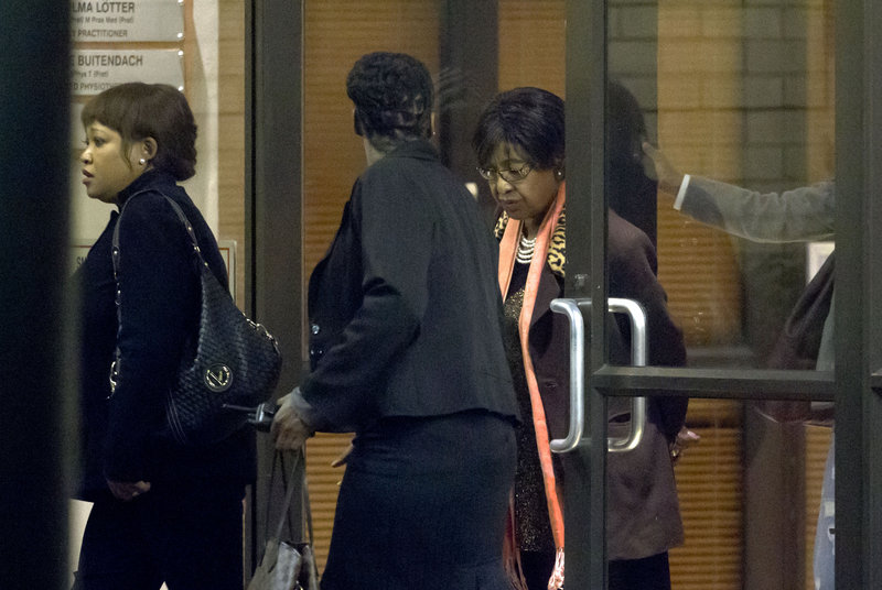 Winnie Madikizela-Mandela, right, departs after paying a visit to the hospital where her former husband Nelson Mandela is being treated in Pretoria, South Africa.