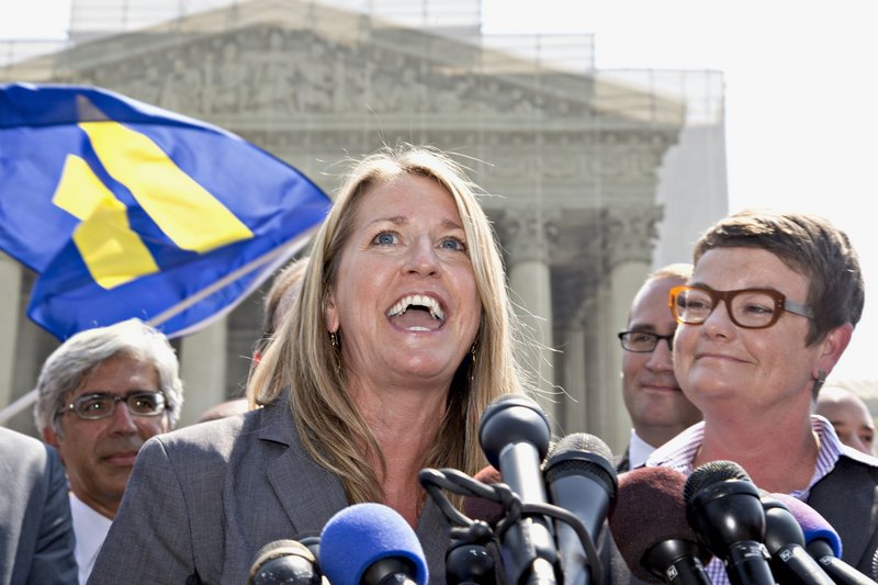 Sandy Stier, left, and Kris Perry react outside the U.S. Supreme Court Wednesday after the court cleared the way for the resumption of same-sex marriage in California.