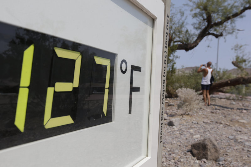 A thermometer shows the temperature in Death Valley National Park, Furnace Creek, Calif., Friday.