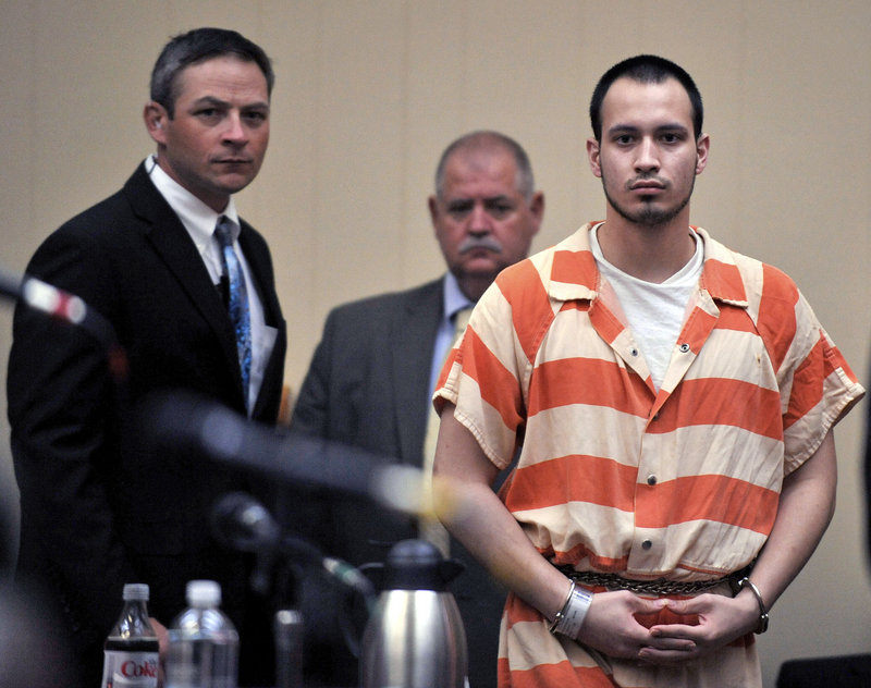 Pvt. Isaac Aguigui walks into the courtroom during a preliminary hearing at Long County Superior Court in Ludowici, Ga., in 2012.
