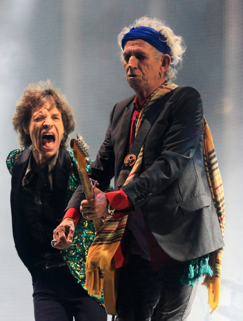 Mick Jagger, left, and Keith Richards of the Rolling Stones perform at Britain’s prestigious Glastonbury Festival on Saturday for the first time.
