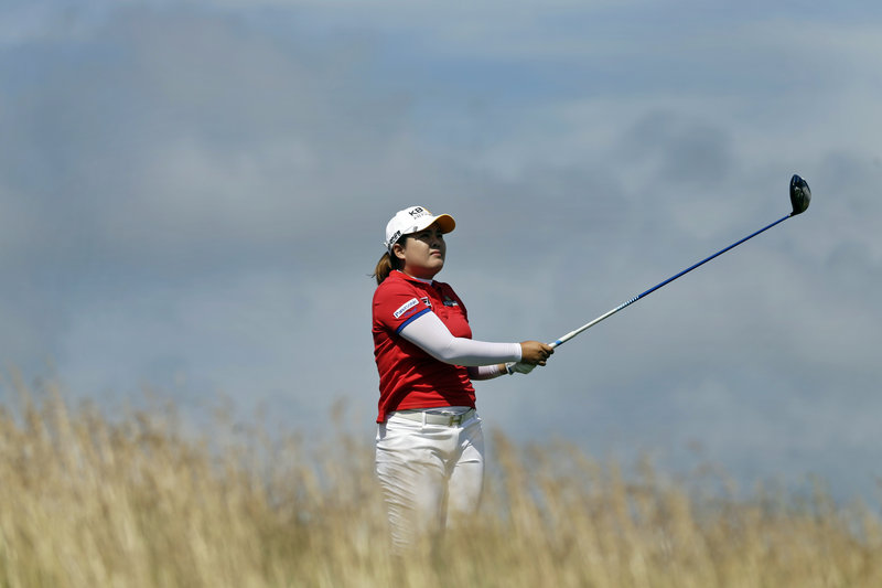 Inbee Park, watching a tee shot Saturday, is in position to become the first LPGA golfer to win the first three majors of a year in which there are four majors. She leads the U.S. Women’s Open by four shots.