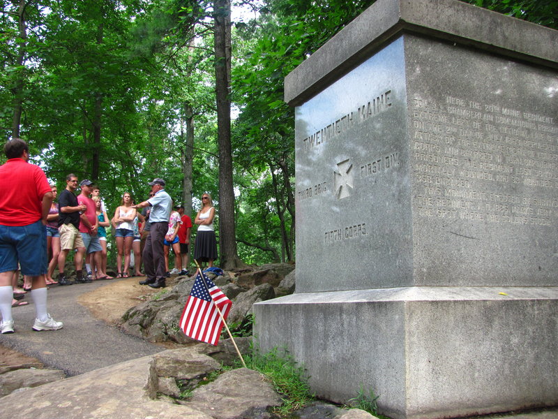 A tour guide Sunday discusses the 20th Maine Regiment’s bayonet charge on Little Round Top, which thwarted Confederate attempts to flank the Union lines at Gettysburg. Col. Joshua Chamberlain ordered the charge against the attacking forces because his troops were nearly out of ammunition and he was told to hold the far-left flank of the Union lines “at all hazard.”