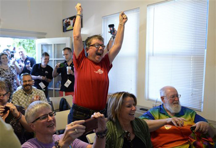 Tina Reynolds celebrates the Supreme Court decision at the LGBT Sacramento Community Center on Wednesday in Sacramento, Calif. The court's ruling cleared the way for the resumption of same-sex marriage in the state of California.