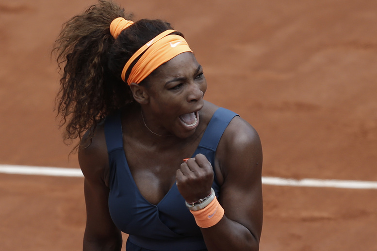 Serena Williams clenches her fist after scoring against Roberta Vinci in their fourth-round match at the French Open on Sunday. Williams won in two sets 6-1, 6-3.