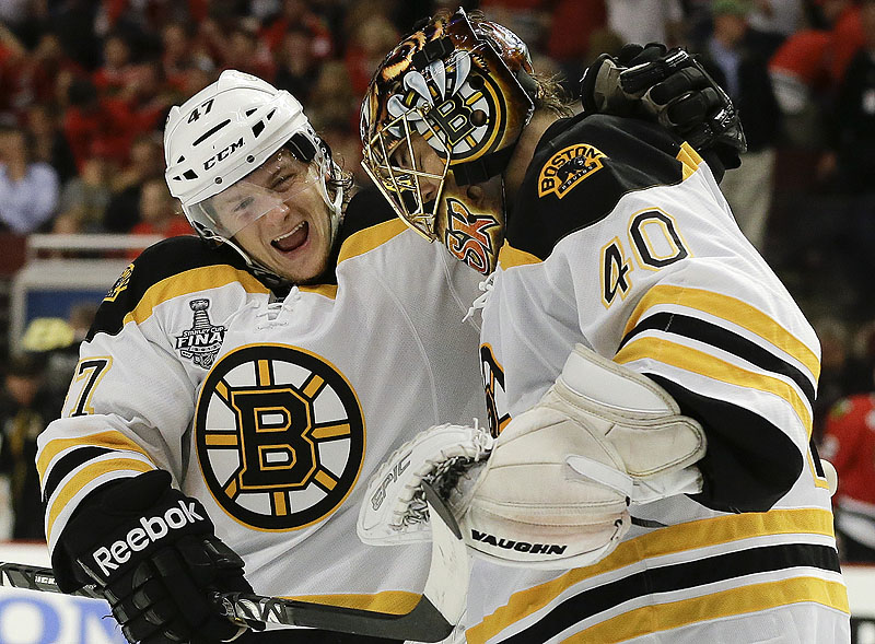 Bruins defenseman Torey Krug celebrates with goalie Tuukka Rask after Boston’s 2-1 overtime win Saturday in Game 2 of the Stanley Cup finals.
