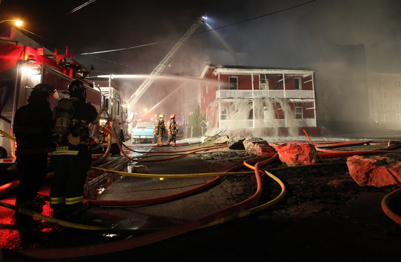 Firefighters battle a blaze early on May 4 that destroyed apartment buildings in Lewiston. The boy who is accused of setting the fire has been ordered held at a treatment facility until his court hearing.