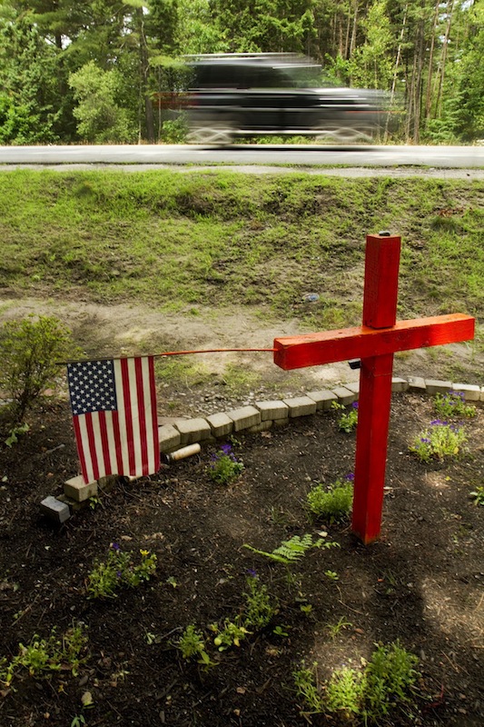 A roadside memorial occupies the location of a fatal accident on Payne Rd., near Holmes Road, in Scarborough on Sunday, June 30, 2013. Roadside memorials have become the centerpiece of a debate as the Scarborough Town Council considers a proposed ordinance that would regulate them. The Town Council will discuss the ordinance at its July 17 meeting.