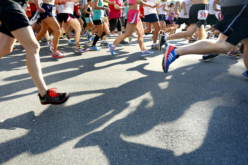 Competitors run down Bow Street at the start of the L.L.Bean Fourth of July 10K Road Race in Freeport.
