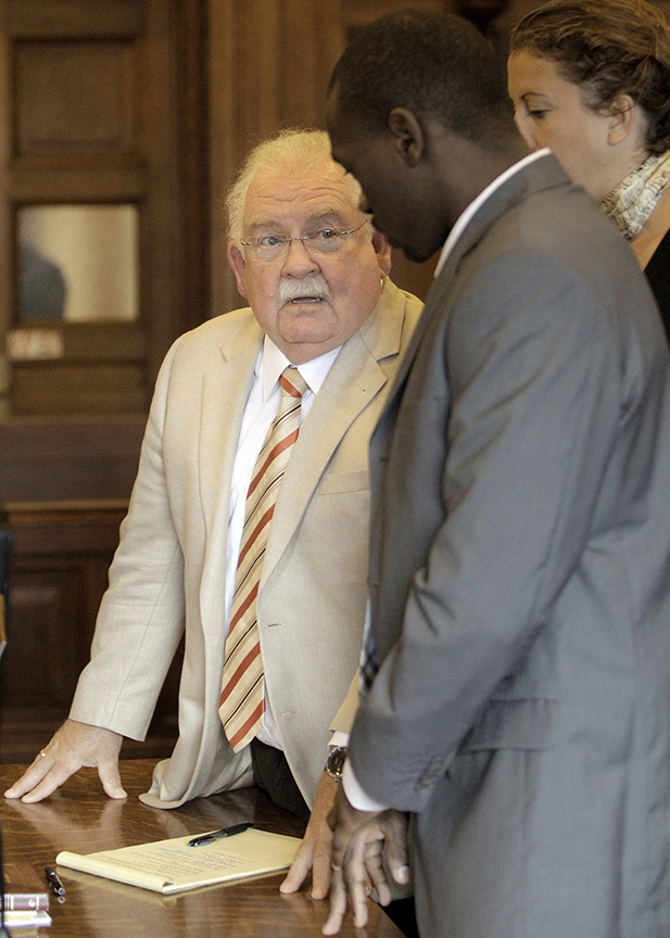 Gabe Souza/Staff Photographer Attorney Daniel Lilley consults with his client Eric Gwaro, Monday, July 29, 2013, after Gwaro was found guilty of aggravated assault, but not guilty of attempted murder.