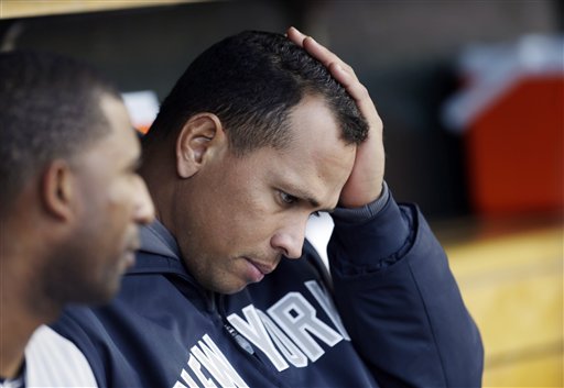 In this 2012 file photo, New York Yankees' Alex Rodriguez watches from the bench. Major League Baseball has reportedly offered the Yankees superstar an ultimatum: Accept a 1.5-year suspension without pay, or fight the charges and possibly never play again. (AP Photo/Paul Sancya)