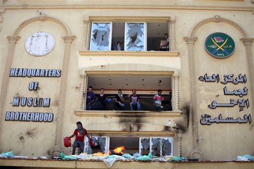Protesters stormed and ransacked the headquarters of President Mohammed Morsi's Muslim Brotherhood group early Monday, in an attack that could spark more violence as demonstrators gear up for a second day of mass rallies aimed at forcing the Islamist leader from power. AP Photo/Khalil Hamra.