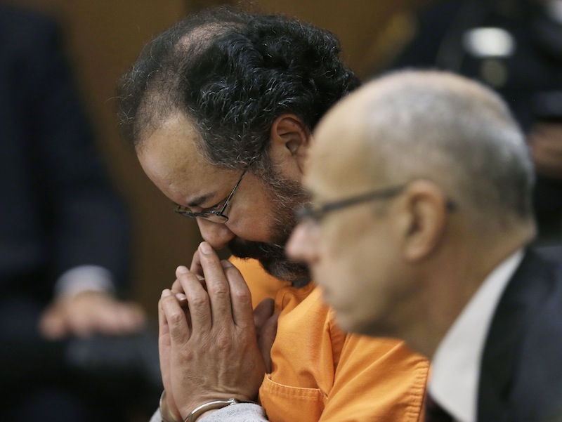 Ariel Castro looks down during court proceedings Friday in Cleveland. Defense attorney Jaye Schlachet is on the right.