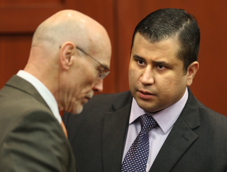 George Zimmerman, right, speaks with defense counsel Don West after the jury leaves the courtroom for more deliberations Saturday in the 25th day of his trial at the Seminole County Criminal Justice Center in Sanford, Fla. Zimmerman later was acquitted in the 2012 shooting death of Trayvon Martin.