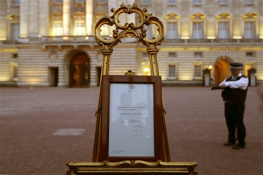 A notice proclaiming the birth of a baby boy to Prince William and Catherine, Duchess of Cambridge is displayed for public view at Buckingham Palace in London on Monday.