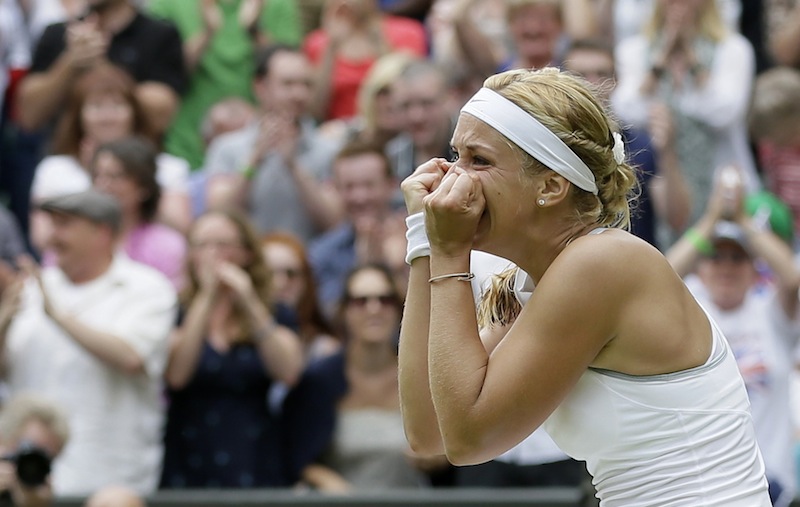 Sabine Lisicki of Germany celebrates after beating Serena Williams of the United States in a Women's singles match at the All England Lawn Tennis Championships in Wimbledon, London, Monday, July 1, 2013. (AP Photo/Alastair Grant)