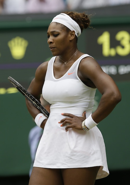 Serena Williams of the United States reacts during her Women's singles match against Sabine Lisicki of Germany at the All England Lawn Tennis Championships in Wimbledon, London, Monday, July 1, 2013. (AP Photo/Alastair Grant)