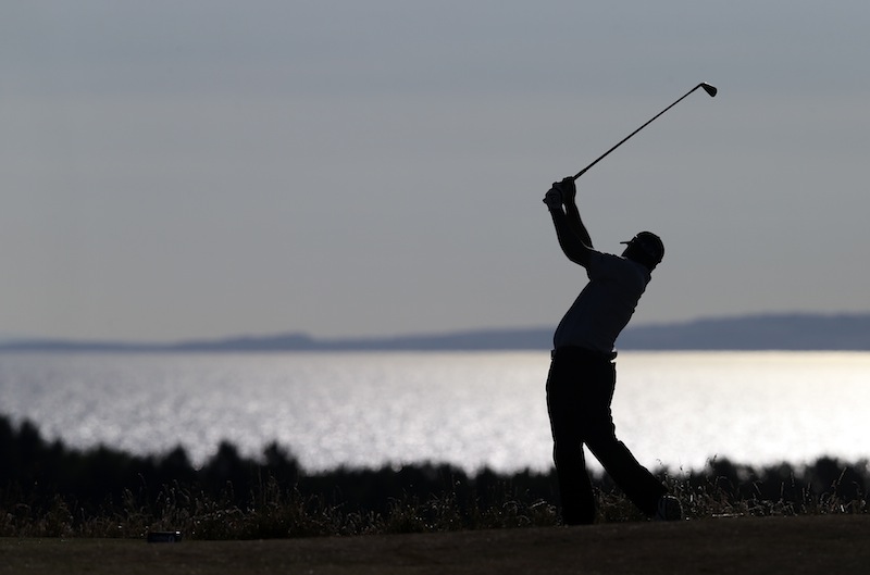 Shiv Kapur of India plays a shot on the 12th hole during the first round of the British Open Golf Championship at Muirfield, Scotland, on Thursday.