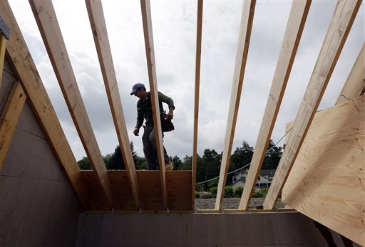 A worker installs a roof on a zero net energy home recently in New Paltz, N.Y. The latest confidence index, based on responses from 281 builders, points to continued improvement for new home construction, which remains a key source of growth for the economy.
