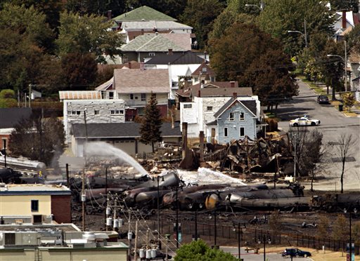Wreckage is strewn through the downtown core in Lac-Megantic, Quebec, on Monday after a train derailed, igniting tanker cars carrying crude oil early Saturday.