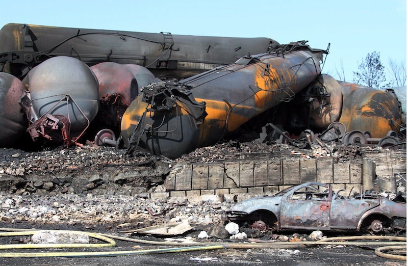 This photo provided by Surete du Quebec, shows wrecked oil tankers and debris from a runaway train on Monday, July 8, 2013 in Lac-Megantic, Quebec, Canada. A runaway train derailed igniting tanker cars carrying crude oil early Saturday, July 6 At least thirteen people were confirmed dead and nearly 40 others were still missing in a catastrophe that raised questions about the safety of transporting oil by rail instead of pipeline. (AP Photo/Surete du Quebec, The Canadian Press) Canada Quebec Montreal;transportation;business;Canada;Canadian;economic;economy;industry;move;ship;shipping;transit;transport;travel industry;commerce;tourism;fire;train;rail;derail;tragedy;disaster