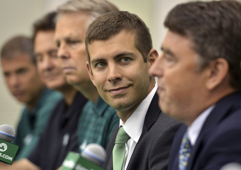 New Boston Celtics head coach Brad Stevens center, sits with, from left, Celtics President Rich Gotham, co-owner Stephen Pagliuca, General Manager Danny Ainge and co-owner and CEO Wyc Grousbeck, right, during a news conference Friday in Waltham, Mass.