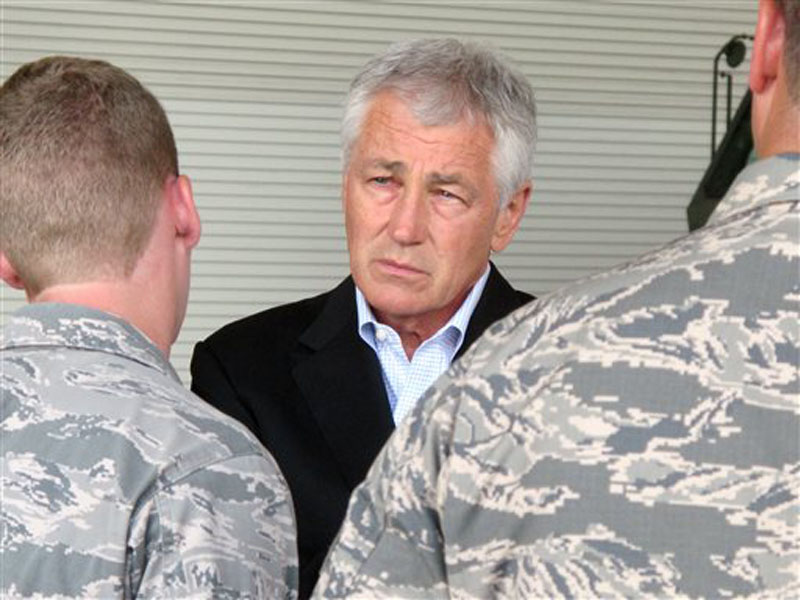 Defense Secretary Chuck Hagel talks with Air Force personnel at Joint Base Charleston near Charleston, S.C., on July 17, the last day