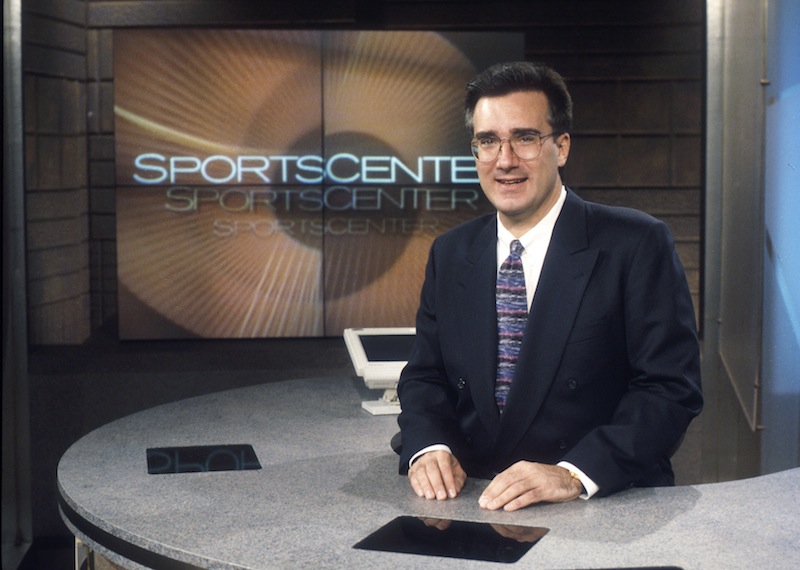 In this photo taken Jan. 13, 1996, and provided by ESPN Images, ESPN on air personality Keith Olbermann poses for a photo on the "SportsCenter" studio set in Bristol, Conn. Olbermann, who rose to prominence as a "SportsCenter" anchor from 1992-97 before one of several contentious departures that have marked his career, is rejoining ESPN to host a late-night show, the network said Wednesday, July 17, 2013. (AP Photo/ESPN Images, Rick LaBranche) ESPN;Keith Olbermann;1996;historical;SportsCenter;set shots;set shot;historic;suit;tie;talent;host;posing