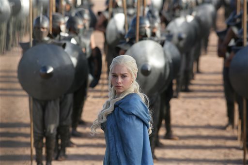 This publicity image released by HBO shows Emilia Clarke in a scene from "Game of Thrones." The program was nominated for an Emmy Award for outstanding drama series. Clarke was also nominated for best supporting actress.
