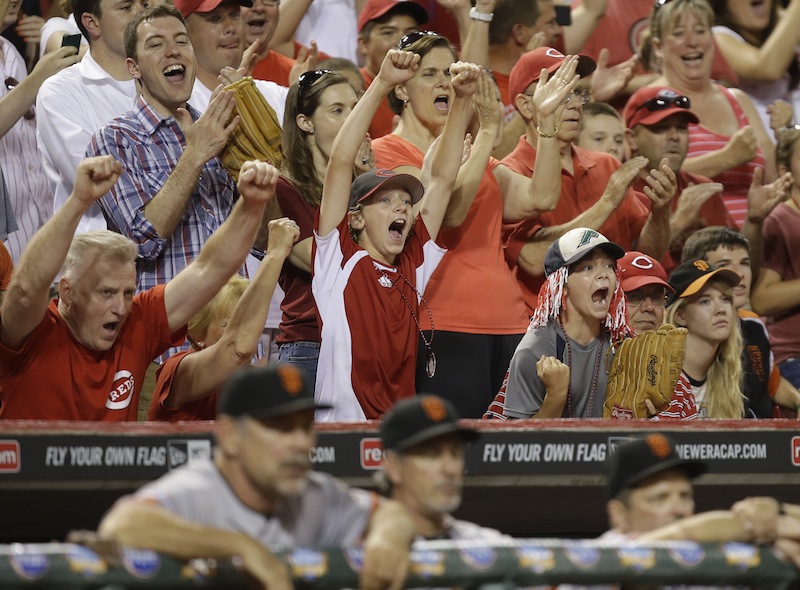 Cincinnati Reds fans react with two outs in the ninth inning of a baseball game against the San Francisco Giants, Tuesday, July 2, 2013, in Cincinnati. Cincinnati won 3-0 behind a no-hitter by Homer Bailey. (AP Photo/Al Behrman)