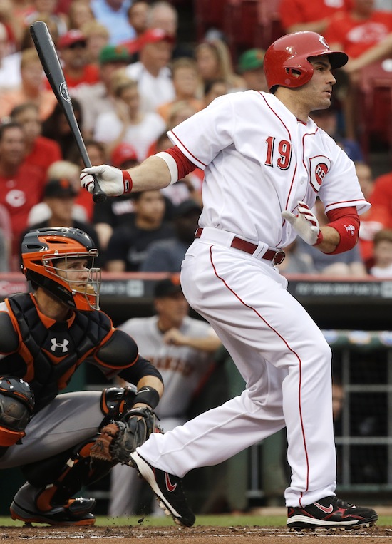Cincinnati Reds' Joey Votto follows through on a double off San Francisco Giants starting pitcher Barry Zito in the first inning of a baseball game, Wednesday, July 3, 2013, in Cincinnati. (AP Photo/Al Behrman)