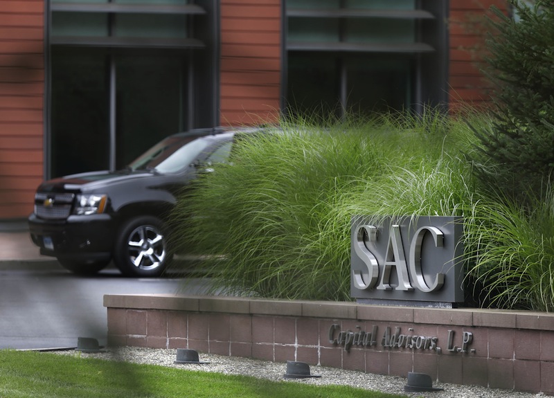A sign is displayed in front of SAC Capital Advisors headquarters in Stamford, Conn., Thursday, July 25, 2013. The hedge fund operated by embattled billionaire Steven A. Cohen was hit with white-collar criminal charges Thursday that accused the fund of making hundreds of millions of dollars illegally, and a related government lawsuit said insider trading was pervasive and unprecedented at the firm. (AP Photo/Seth Wenig)