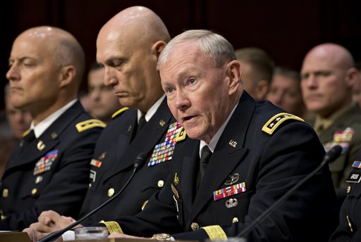 Chairman of the U.S. Joint Chiefs of Staff, Gen. Martin Dempsey, right, testifies on Capitol Hill in Washington in this FILE - In this June 4, 2013, photo.