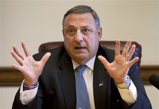 In this June 26, 2013 file photo, Gov. Paul LePage speaks to reporters shortly after the Maine House and Senate both voted to override his veto of the state budget. LePage has raised nearly $340,000 for his 2014 re-election bid, according to a campaign finance report filed with the state late Monday.