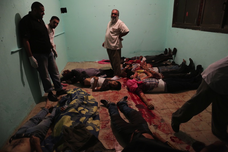 Bodies lie in a room of a hospital after shooting happened at the Republican Guard building in Nasr City, Cairo, Monday, July 8, 2013. Egyptian soldiers and police opened fire on supporters of the ousted president early Monday in violence outside the military building in Cairo where demonstrators had been holding a sit-in, government officials and witnesses said. (AP Photo/Wissam Nassar)