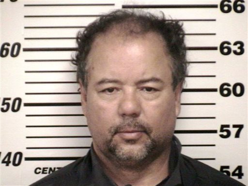 This undated file photo provided by Cuyahoga County Jail shows Ariel Castro. Castro, accused of holding three women captive in his home for a decade, has been indicted Friday on 329 charges including kidnapping and rape, prosecutors said. The grand jury charged the former school bus driver with one count of aggravated murder, saying he purposely caused the unlawful termination of a pregnancy.