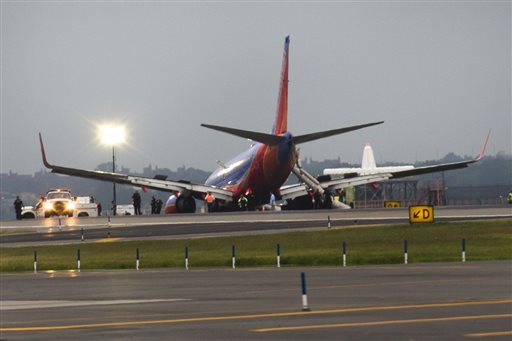 A Southwest Airlines plane rests on the tarmac after a nose gear collapse during a landing at LaGuardia Airport on Monday in New York.