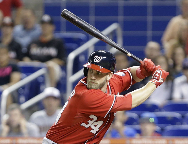 Washington Nationals' Bryce Harper bats during the first inning of a baseball game against the Miami Marlins on Saturday in Miami. He's one of a group of young, talented players who've brought new energy to the game.