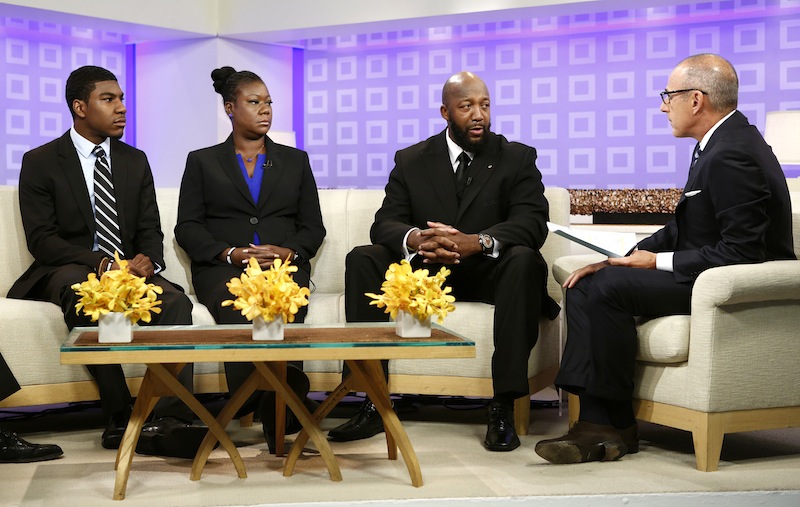 In this image released by NBC, parents of Trayvon Martin, Sybrina Fulton, second left, and Tracy Martin, second right, appear on the "Today" show with Fulton's other son Jahvaris Fulton, left, and co-host Matt Lauer in New York. Martin's parents plan to participate in separate vigils on Saturday. Sabrina Fulton and Jahvaris Fulton will join Al Sharpton outside New York Police Department headquarters while Tracy Martin is set to be at a similar event at a federal courthouse in Miami. (AP Photo/NBC, Peter Kramer) Episodic;NUP_157153