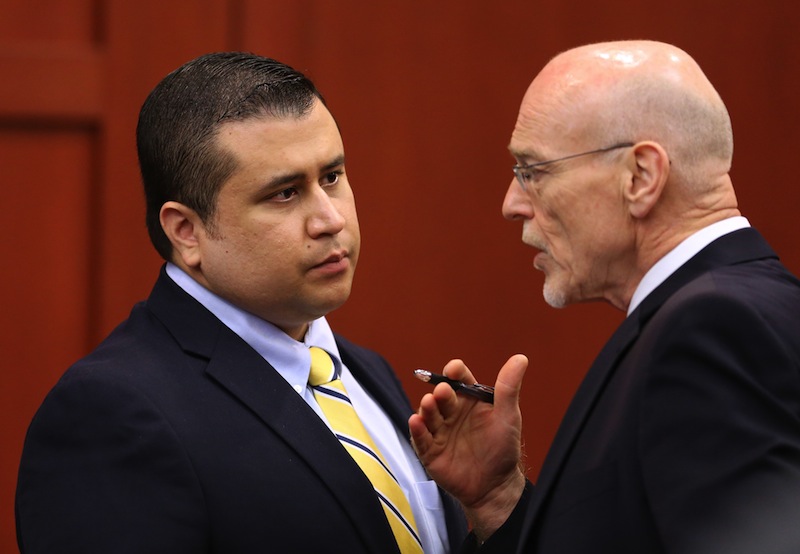 George Zimmerman, left, speaks to defense counsel Don West during a recess in his trial in Seminole circuit court, in Sanford, Fla., Monday, July 8, 2013. Zimmerman is charged with second-degree murder in the fatal shooting of Trayvon Martin, an unarmed teen, in 2012. (AP Photo/Orlando Sentinel, Joe Burbank, Pool)