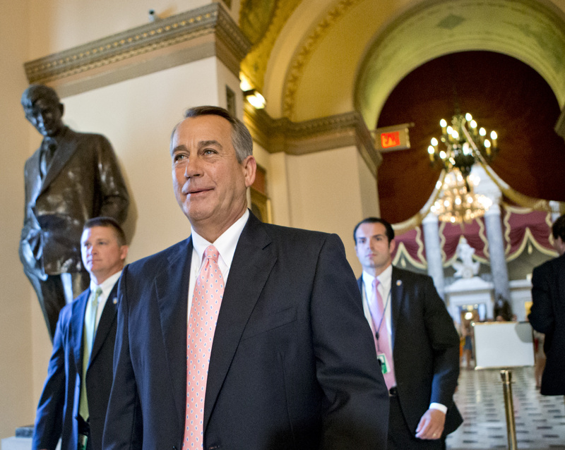 Speaker of the House John Boehner, R-Ohio, smiles as he walks to the floor of the House of Representatives as the Republican majority passed legislation to replace the No Child Left Behind law, in Washington on Friday.